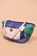Load image into Gallery viewer, Vintage early 2000&#39;s colorblock blue, green, and white leather purse is shown from the side. This Coach Carrie purse has silver hardware. 
