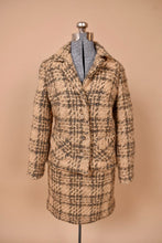 Load image into Gallery viewer, Vintage two piece 1960&#39;s tan tweed wool suit is shown from the front. This suit set has a blazer and mini skirt. 

