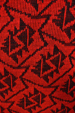 Load image into Gallery viewer, Vintage 80s geometric patterned red and black knit dress is shown in close up. 
