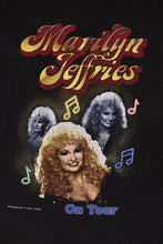 Load image into Gallery viewer, Vintage 2000&#39;s soft black cotton Marilyn Jeffries On Tour country music tee shirt is shown in close up.
