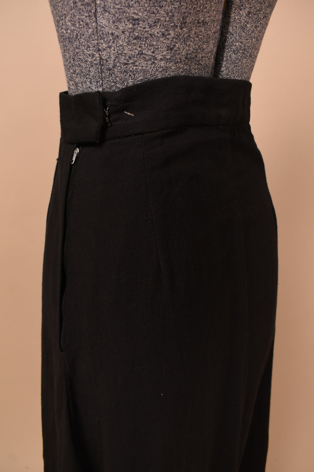 Vintage black cotton sixties maxi skirt is shown in close up. This skirt has a zipper closure.