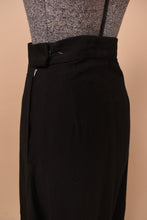 Load image into Gallery viewer, Vintage black cotton sixties maxi skirt is shown in close up. This skirt has a zipper closure.
