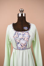 Load image into Gallery viewer, Vintage 70&#39;s mint green handmade midi dress is shown from the front. This dress has a navy floral print panel at the bust.
