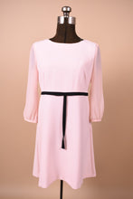 Load image into Gallery viewer, Vintage new with tags Ted Baker London pale pink babydoll dress is shown from the front. This dress has sheer sleeves.
