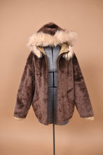 Load image into Gallery viewer, Vintage 60&#39;s faux fur brown cropped jacket is shown from the front. This jacket is lined with a fuzzy tan faux fur. 
