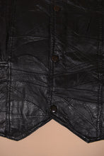 Load image into Gallery viewer, Vintage 90&#39;s black leather patchwork vest is shown in close up. 
