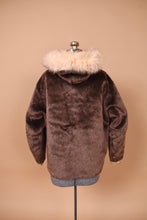 Load image into Gallery viewer, Vintage 60s brown and tan faux fur teddy bear coat is shown from the back. 
