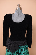 Load image into Gallery viewer, Vintage 80s Escada rose print party dress is shown from the front. This dress is black with an oversized bow at the waist.
