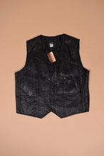 Load image into Gallery viewer, Vintage 1990&#39;s black leather vest is shown from the front. This vest has an American flag on the back.
