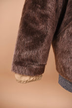 Load image into Gallery viewer, Vintage brown faux fur cropped jacket by ULLA by Bergdorf Goodman is shown in close up. This jacket has a tan lining.

