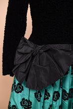 Load image into Gallery viewer, Vintage 80&#39;s green Escada drop waist party dress is shown in close up. This dress has a teal and black rose print skirt.

