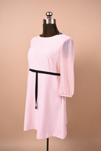 Load image into Gallery viewer, Ballerina pink new with tags Ted Baker London babydoll pink dress is shown from the side. This dress has a black ribbon under the bust.
