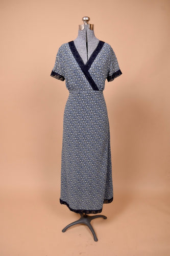 Vintage 1990's lacy blue floral Laura Ashley maxi dress is show from the front. This dress is made from a navy calico silk chiffon.