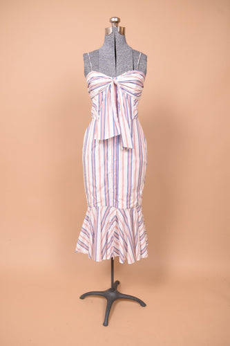 Vintage designer deadstock striped cotton dress is shown from the front. This dress is red white and blue pinstripes.