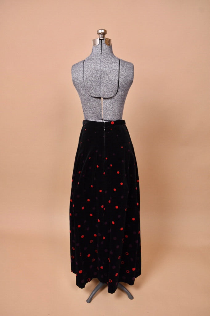 The skirt faces backward on the mannequin.