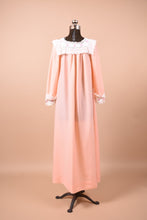 Load image into Gallery viewer, Vintage peach sleepwear maxi dress shown from the back. This dress has a white lace bib collar.
