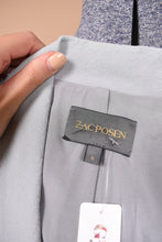 Load image into Gallery viewer, Vintage designer slate blue y2k cropped blazer is shown in close up. This blazer has a tag that reads Zac Posen.
