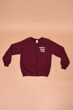 Load image into Gallery viewer, The sweatshirt lies flat. The sleeves have cuffs.
