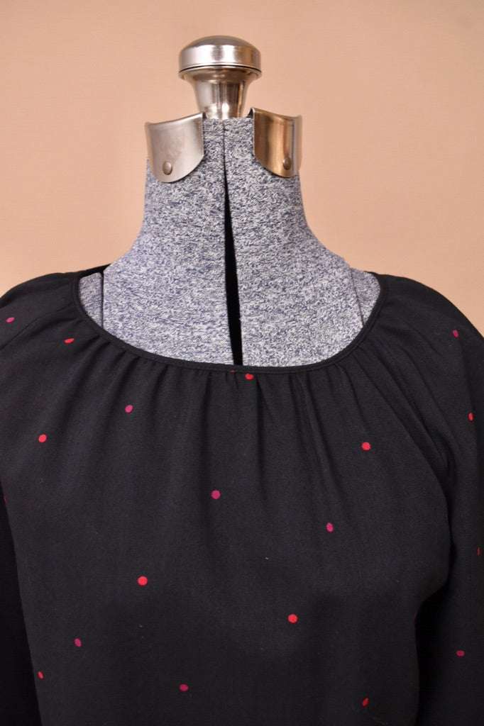 The top pleating at the neck is visible.